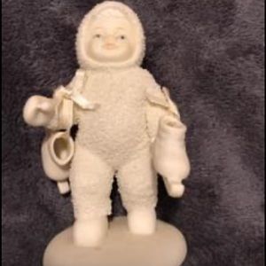 Skater Snowbabie with her skates in her hand